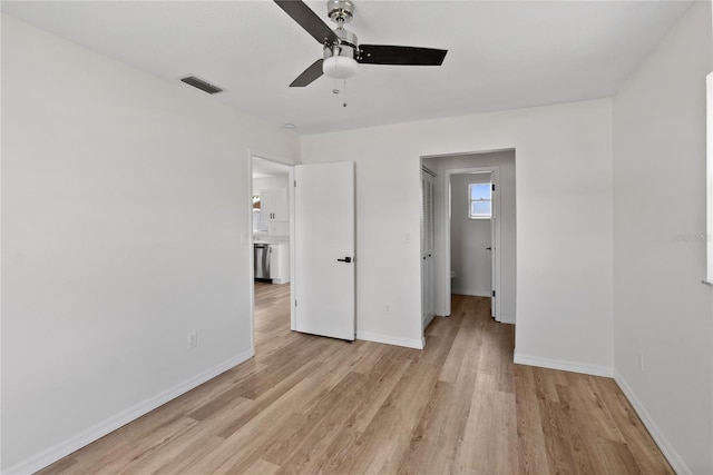 unfurnished bedroom featuring ceiling fan and light hardwood / wood-style floors