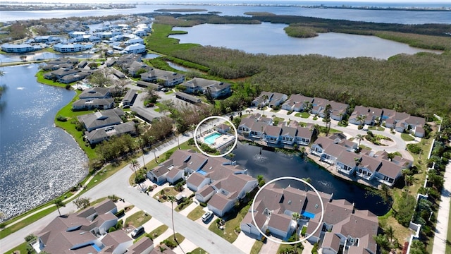 birds eye view of property featuring a water view