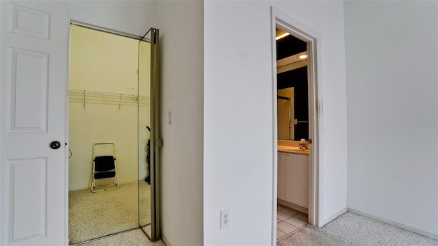 interior space featuring sink and light tile patterned floors