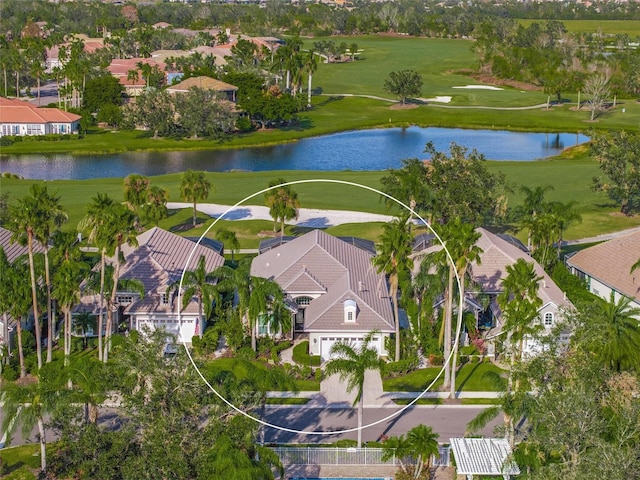 birds eye view of property featuring a water view and a residential view