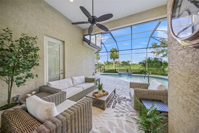 view of patio / terrace featuring an outdoor living space, a lanai, and ceiling fan