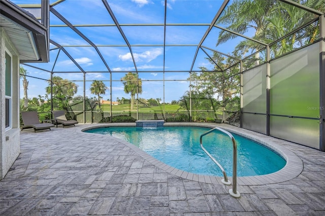 pool with a lanai, a jacuzzi, and a patio