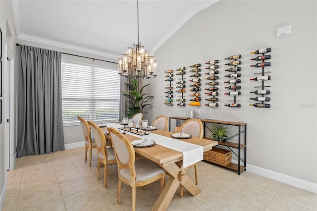 dining space with lofted ceiling, crown molding, baseboards, and light tile patterned floors