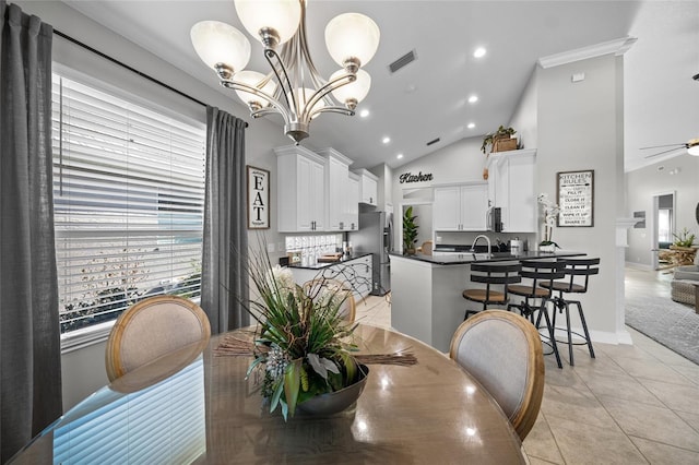 dining space with recessed lighting, visible vents, light tile patterned flooring, high vaulted ceiling, and ceiling fan with notable chandelier