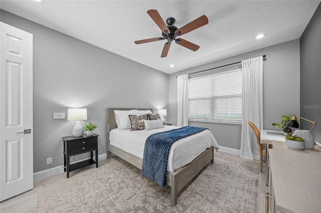 bedroom featuring ceiling fan, baseboards, and recessed lighting