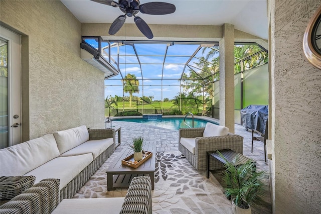 exterior space with a lanai, a patio area, an outdoor hangout area, and a ceiling fan