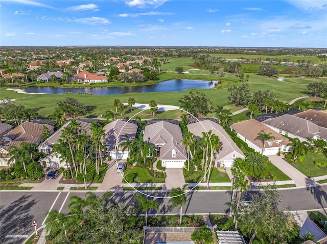 birds eye view of property featuring a water view and a residential view