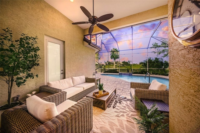 view of patio / terrace featuring ceiling fan, outdoor lounge area, a lanai, and an outdoor pool