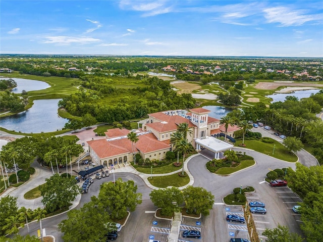 birds eye view of property with a water view and a residential view