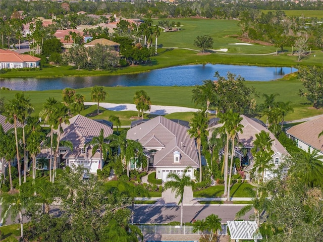 drone / aerial view with a water view and a residential view