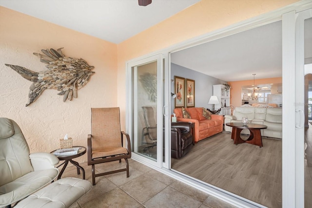 living area with a notable chandelier