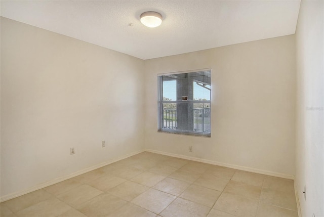 view of tiled spare room