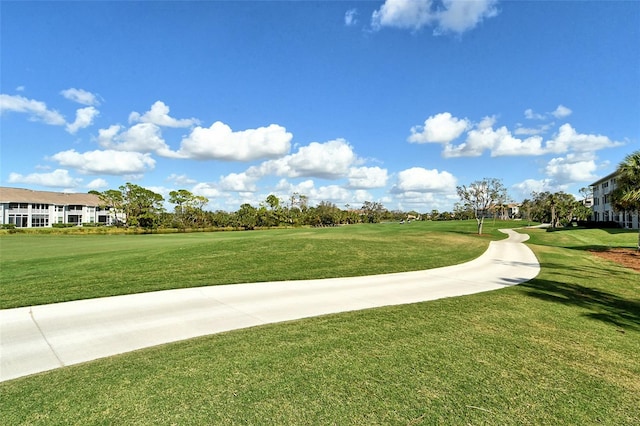 view of home's community featuring a lawn