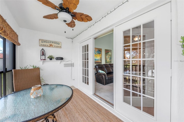 dining area with ceiling fan and carpet flooring