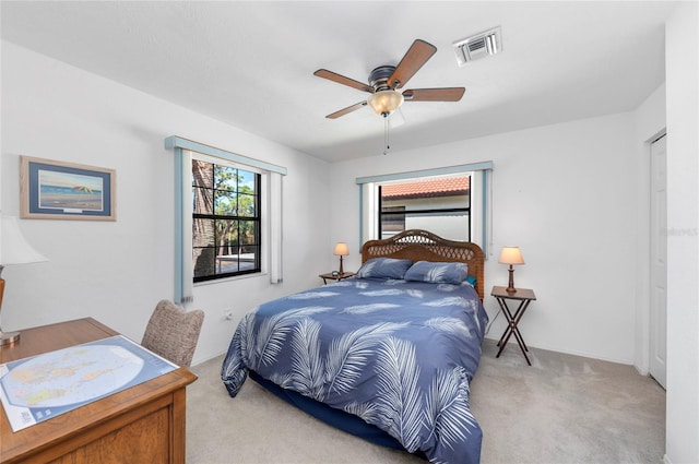 carpeted bedroom featuring ceiling fan