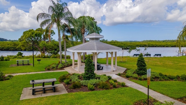 surrounding community featuring a water view, a lawn, a patio, and a gazebo