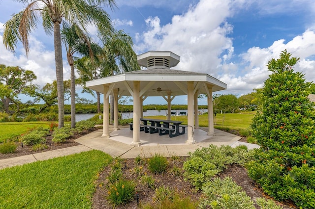 view of patio featuring a water view and a gazebo