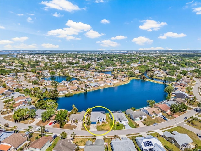 bird's eye view featuring a residential view and a water view