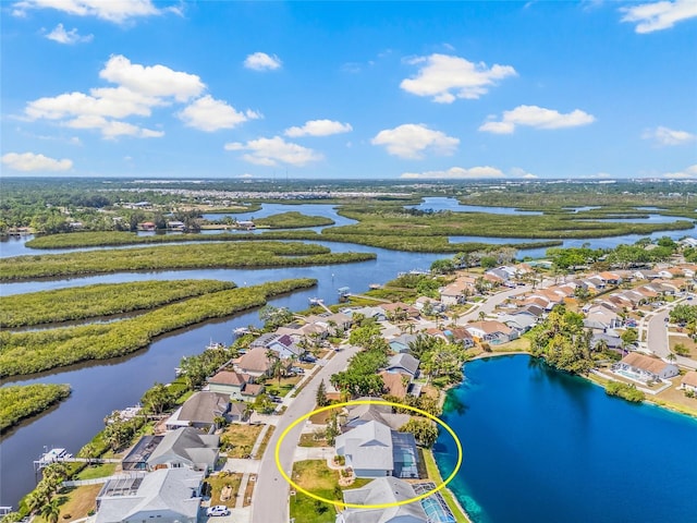 aerial view featuring a residential view and a water view
