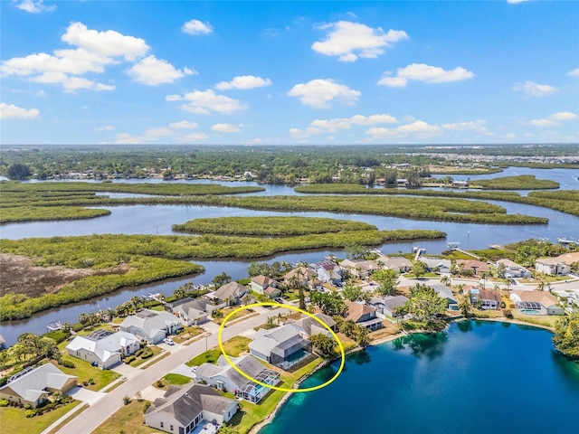 aerial view with a residential view and a water view