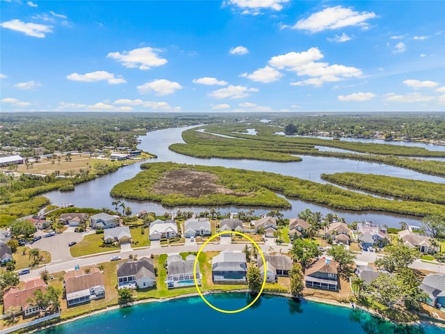 birds eye view of property featuring a water view and a residential view