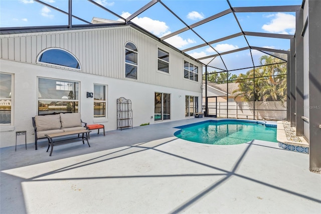 view of swimming pool featuring an outdoor hangout area, fence, a patio, glass enclosure, and a fenced in pool