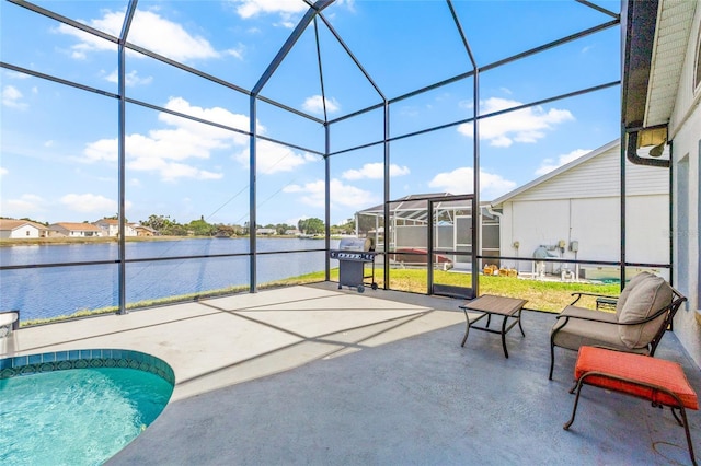 outdoor pool with a water view, a lanai, and a patio
