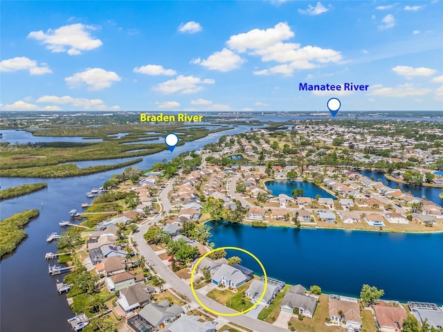 aerial view with a residential view and a water view