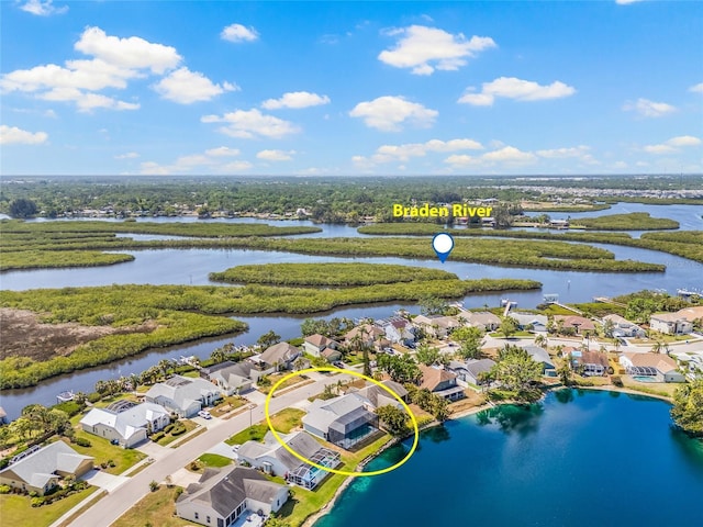 drone / aerial view featuring a residential view and a water view