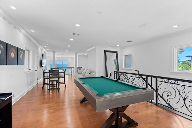 rec room with decorative columns, light hardwood / wood-style flooring, pool table, and ornamental molding