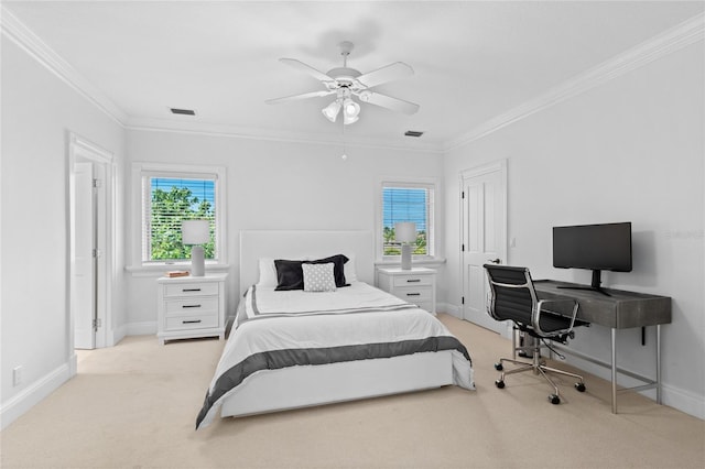 carpeted bedroom with ceiling fan and ornamental molding