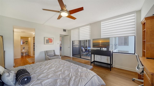 bedroom with ceiling fan and light hardwood / wood-style flooring