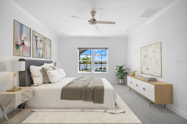 bedroom with light carpet, ceiling fan, and crown molding