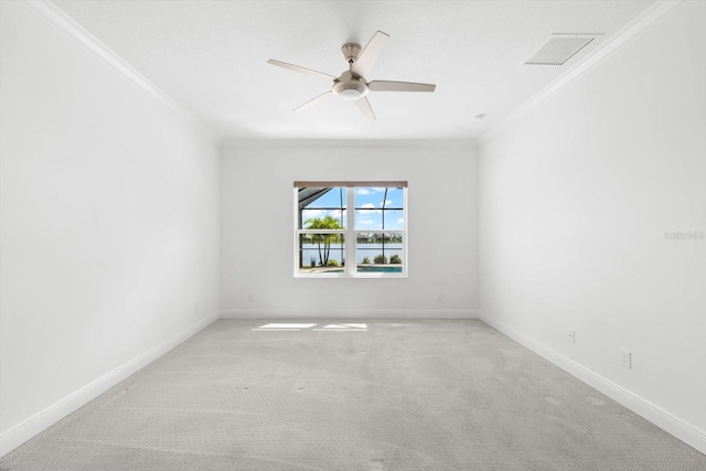 unfurnished room with crown molding, ceiling fan, and light colored carpet