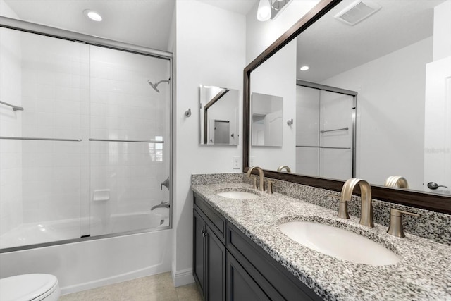 4704 Foxtail Dr, Parrish, FL 34219 - full bathroom with toilet, combined bath / shower with glass door, double vanity, and recessed lighting