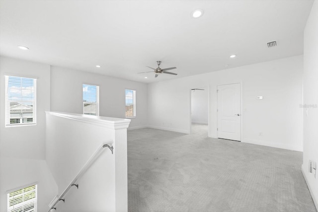 4704 Foxtail Dr, Parrish, FL 34219 - spare room featuring light carpet, recessed lighting, plenty of natural light, ceiling fan, and baseboards