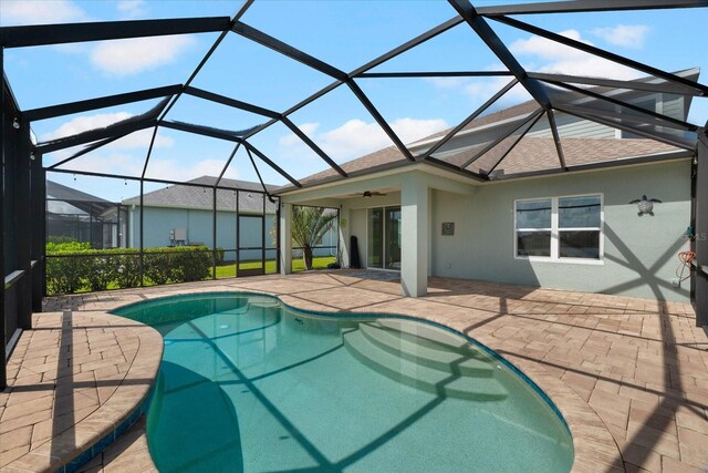 4704 Foxtail Dr, Parrish, FL 34219 - outdoor pool with a patio area, ceiling fan, and glass enclosure