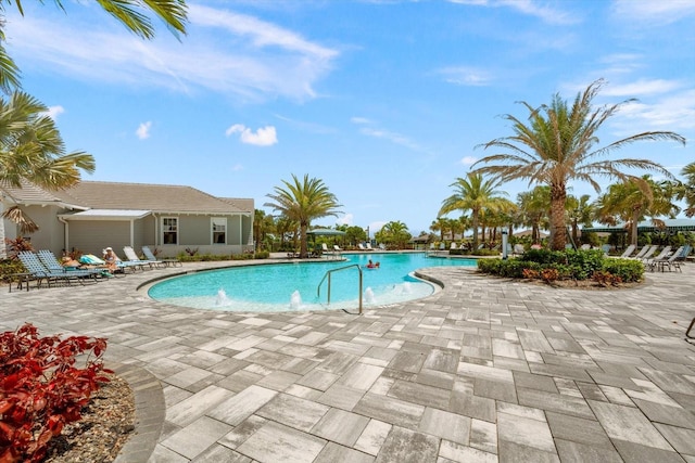 view of swimming pool featuring a patio area and pool water feature