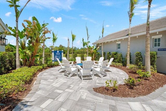 view of patio with a fire pit