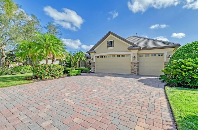 view of front facade featuring a garage and a front lawn