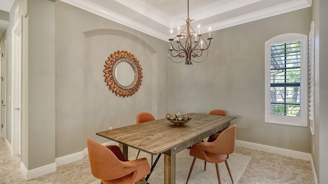 dining room featuring crown molding and a notable chandelier