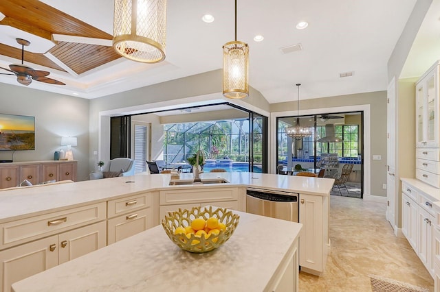 kitchen featuring dishwasher, decorative light fixtures, sink, and a center island