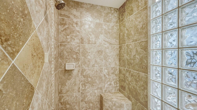 interior details with a tile shower