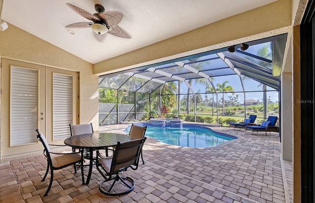 view of pool with a patio area, a lanai, and ceiling fan