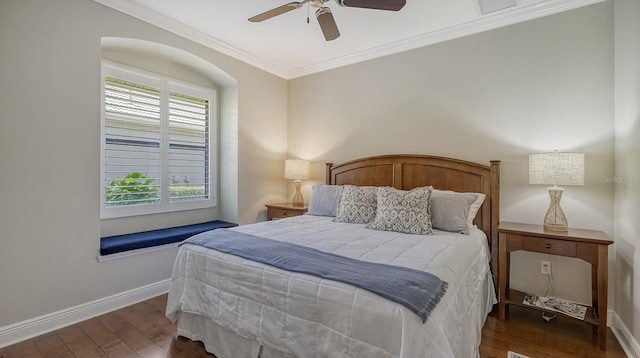 bedroom featuring dark wood-type flooring, ceiling fan, and crown molding