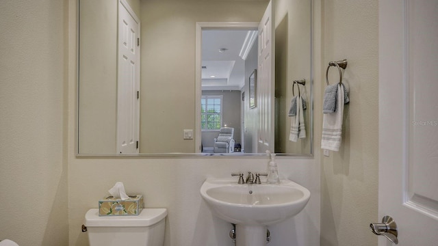 bathroom featuring toilet and sink