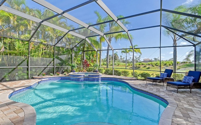 view of swimming pool with a patio area, a lanai, and an in ground hot tub