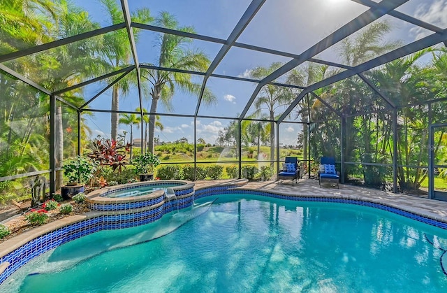 view of pool featuring a lanai and an in ground hot tub