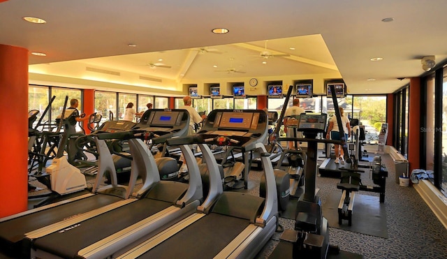 workout area with carpet, vaulted ceiling, and ceiling fan