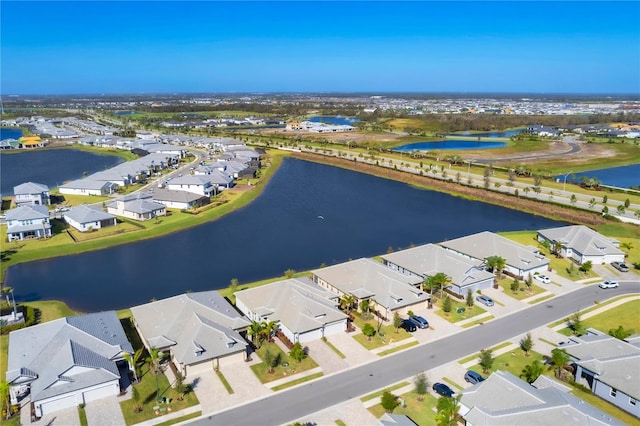 drone / aerial view with a water view